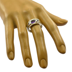 Tereza abstract purple gemstone ring with silver band shown on a display hand