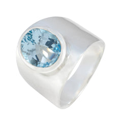 Bianca blue gemstone solitaire ring with a polished silver band and round blue stone
