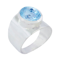 Bianca blue gemstone solitaire ring with a large faceted blue stone set in polished silver band