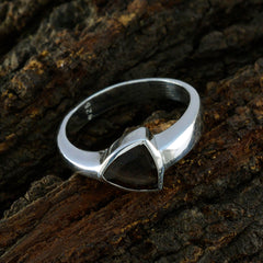 Siti artisan brown solitaire ring with a triangular brown stone set in a silver band on textured bark