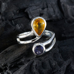 Ines artisan multicolor toi et moi ring featuring yellow pear-shaped and round purple gemstones on silver band