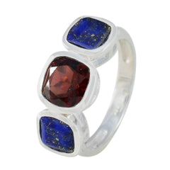Isabel artisan multicolor trilogy ring with one red and two blue square gemstones set in silver band