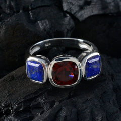 Isabel artisan multicolor trilogy ring with red center stone and blue side stones on silver band