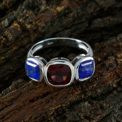Isabel artisan multicolor trilogy ring with red and blue gemstones set in silver band