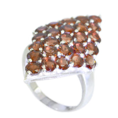 Natcha red gemstone statement ring with clustered round red brown stones in a silver setting