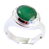 Savannah green solitaire ring featuring an oval green gemstone in a polished silver bezel band