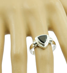 Laura black solitaire ring with triangular black stone set in silver band on finger