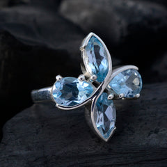 Sarah blue gemstone floral ring with four large blue gemstones in silver setting