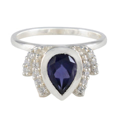 Dewi blue gemstone halo ring with pear-shaped blue stone and surrounding clear crystals