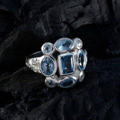 Dewi blue navratna gemstone ring featuring multiple blue stones set in silver band