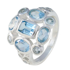 Dewi blue navratna gemstone ring with multiple light blue oval and rectangular stones on silver band