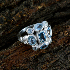 Dewi silver ring featuring a blue navratna gemstone ring with multiple blue stones in different cuts