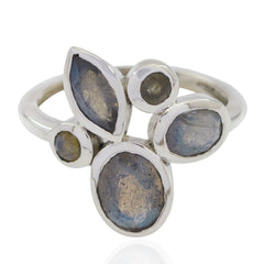 Violet boho gemstone ring with multiple irregularly shaped blue stones set in silver band