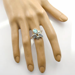 Violet boho gemstone ring with multiple oval stones on hand display