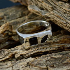 Violet boho toi et moi ring in silver with black geometric stones on rustic wood background