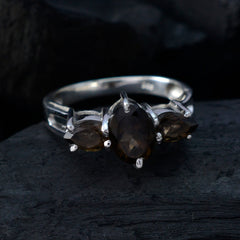 Jiwoo brown gemstone trilogy ring with three dark brown stones set in silver band