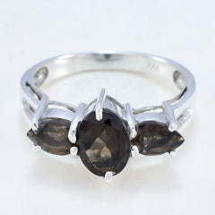 Jiwoo brown gemstone trilogy ring with three polished oval and pear-shaped brown stones set in silver band