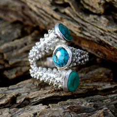 Natalie contemporary turquoise trio ring with three turquoise stones set on a textured silver band