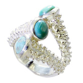 Natalie contemporary turquoise trio ring with three turquoise stones and intricate silver detailing