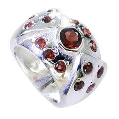 Ines red gemstone ethnic ring featuring multiple red stones set in a wide silver band