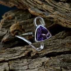 Liyana geometric purple gemstone ring with a triangular cut amethyst set in silver band on textured wood