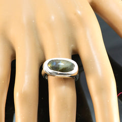 Aisha Graceful Grey Solitaire Ring on mannequin hand with oval grey iridescent stone set in polished silver band