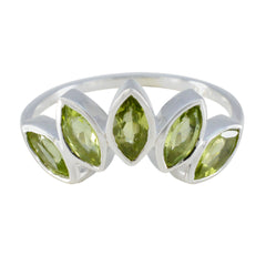 Jia silver ring with five marquise-cut green gemstones in a crown design green gemstone crown ring