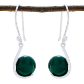 Natalie green solitaire dangle earrings featured on a rustic branch for stylish elegance