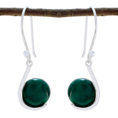 Natalie green solitaire dangle earrings featured on a rustic branch for stylish elegance