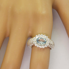 Putri artisan blue halo ring in sterling silver with oval aquamarine center and pave diamond halo and band