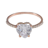 Natcha heart halo ring with a large heart-shaped clear gemstone and small stones on rose gold band