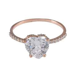 Natcha heart halo ring with a large heart-shaped clear gemstone and small stones on rose gold band