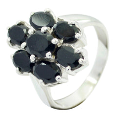 lara black gemstone floral ring with seven round faceted black stones in silver floral cluster band