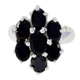 Lara black gemstone floral ring with seven oval black stones in silver floral cluster setting for elegant evening wear