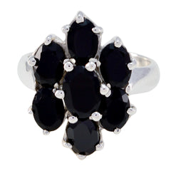 Lara black gemstone floral ring with seven oval black stones in silver floral cluster setting for elegant evening wear