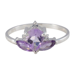 Lakshmi crown ring purple featuring a silver band with purple and clear gemstones in a crown design