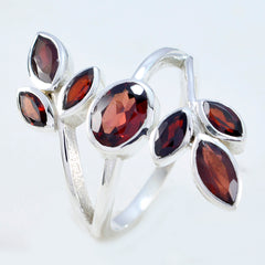 Teresa leafy red gemstone ring with silver band and multiple marquise red stones in a leaf design