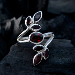 Leafy red gemstone ring by Teresa with silver band and marquise shaped red stones