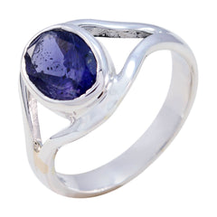 Ananya modern blue gemstone ring featuring a round blue stone set in a polished silver band
