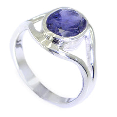 Ananya modern blue gemstone ring featuring a polished silver band with a round blue stone