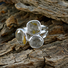 Florencia modern golden trilogy ring with three clear quartz stones set in polished silver band