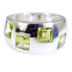 Priya modern green gemstone ring with square green stones set in a wide silver band
