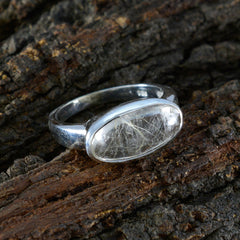 Claire modern solitaire ring for women with an oval clear gemstone set in silver band