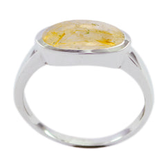 Claire modern solitaire ring for women featuring a silver band and oval yellow gemstone