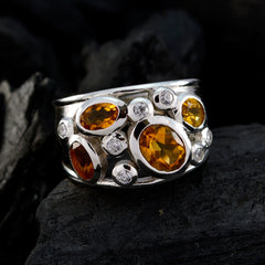 Evelyn modern yellow gemstone ring with multiple oval yellow stones and small clear accents on silver band