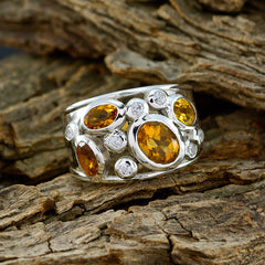 Evelyn modern yellow gemstone ring with multiple oval yellow stones and small clear accents in silver setting