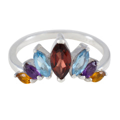 Dewi multicolor gemstone crown ring with red, blue, purple, and yellow stones set in silver band