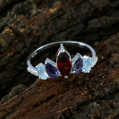 Seo-yeon multicolor gemstone crown ring with red, blue, and purple stones set in silver band