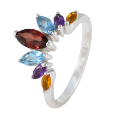 Dewi multicolor gemstone crown ring featuring blue, purple, red, and orange stones on silver band