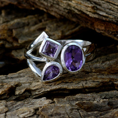 Saanvi purple gemstone trilogy ring with three distinct purple stones set in polished silver band